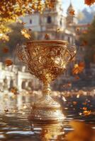 Golden trophy resting on water during autumn with falling leaves photo