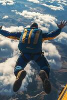 Skydive adventure over breathtaking mountain landscape under clear blue sky photo