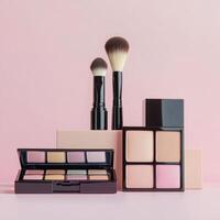 Makeup palette and brushes arranged on pink background for beauty and cosmetic enthusiasts photo