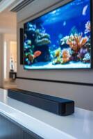 Modern living room with soundbar and aquarium view on television screen photo