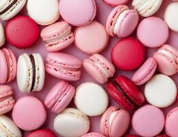 Colorful assortment of pink macarons displayed on a pastel background photo