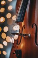 Beautiful wooden violin with soft bokeh lights in the background during a festive evening photo