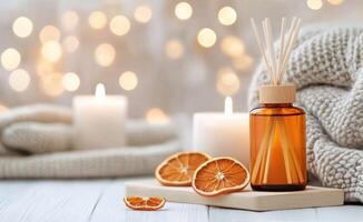 Warm and cozy atmosphere with candles and aromatic diffuser in a serene setting photo