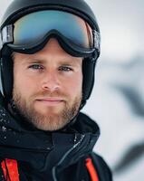 Male skier with goggles and helmet enjoying winter sport in snowy mountain landscape photo