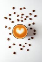 Warm cup of coffee with heart design surrounded by coffee beans and cocoa powder photo