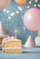 A delightful birthday cake with balloons and party hats ready for celebration photo