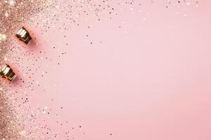 Glitter particles scattered across a soft pink background creating a festive atmosphere photo