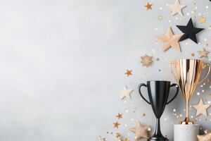 Golden trophy surrounded by flowers and fairy lights for celebratory event at night photo