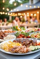 Outdoor summer barbecue party with grilled meats and fresh sides under string lights photo