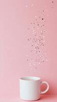 A whimsical white cup releasing sparkling stars against a pastel pink background photo