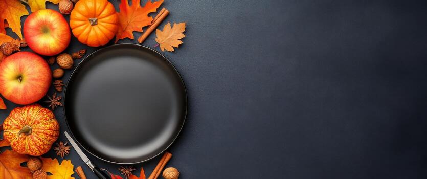 A rustic autumn display with pumpkins, apples, and spices around a black frying pan photo