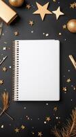 Elegant flat lay of a blank notebook surrounded by festive decorations on a dark background photo