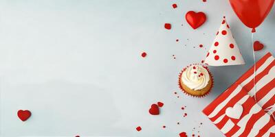 Colorful birthday decorations with cupcake and gift box on blue background for celebration photo