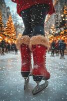 Skater glides on ice in festive winter market adorned with lights and a Christmas tree photo