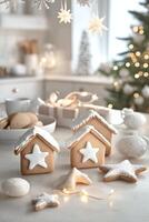 Gingerbread house decorations and star cookies displayed in a cozy holiday setting photo