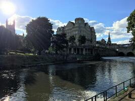 A river with a bridge and buildings in the background photo