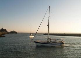 Berkeley, CA, 2006 - Large Sailboats Motoring Into Marina From Bay photo
