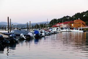 Gold Beach, OR, 2012 - Motorboats In Slips Of Marina With Buildings Trees Sky photo