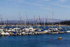 Monterey, CA, 2012 - Boats In Berths At Docks With Blue Water And Sky photo