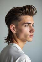 A young man with a mohawk and a side part photo