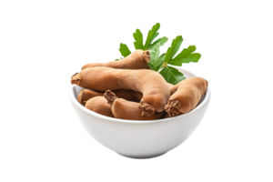 Tamarind pods in a bowl with leaves isolated on a transparent background png