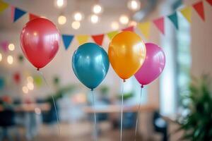 A bunch of colorful balloons in a modern office space with blurred triangle flag background. photo