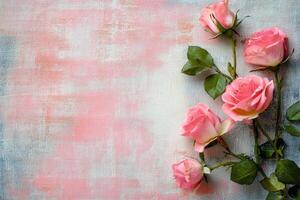 pink roses on light pink denim background, flat lay style. The rose bouquet is placed at the bottom left corner and has an empty space to add text photo