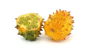 Detailed image showcasing a vivid kiwano melon, also known as horned melon photo