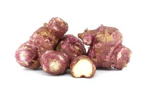 Close-Up of Fresh Jerusalem Artichokes on White Background photo