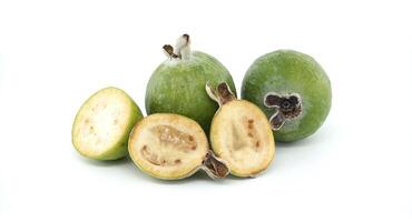 Fresh Green Feijoa Fruits with Sliced Halves on White Background photo