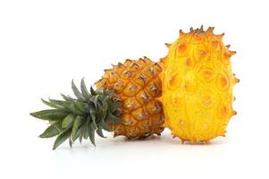 Exotic Pineapple and Horned Melon on White Background photo