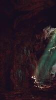 A mysterious cave illuminated by a beam of light video