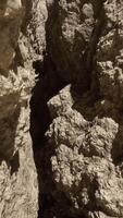 A rock formation with a hole in the middle of it video