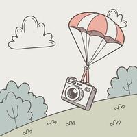 a camera with a parachute flying over a field vector