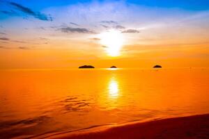 Beautiful sunset tropical beach.sky on twilight time and reflection on the sea for travel and vacation photo