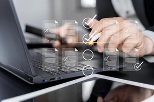 Checklist business performance monitoring concept, Business using tablet online survey filling out check photo