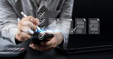 Checklist business performance monitoring concept, Business using tablet online survey filling out check digital form task photo