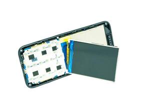 Disassembled old phone revealing internal components, showcasing technology intricate design. Ideal for tech enthusiasts and educational purposes. photo