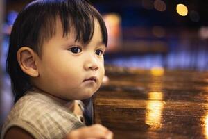 Toddlers Are Aaiting For Food At The Dining Table photo