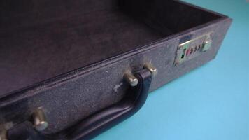 open black dirty case with handle on light blue background video
