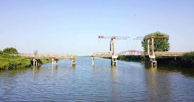 Movement towards a destroyed bridge over the river video