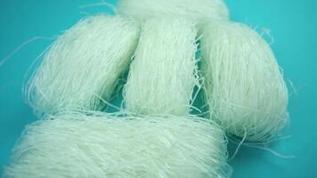 camera turns right around uncooked rice noodle blocks video