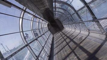 glass tunnel with dirty windows and closed shutter near sea video