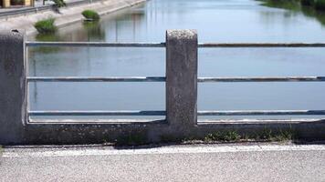 motion along bridge with road and old concrete handrails video