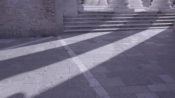 stone steps to antique columns on city square in Venice video