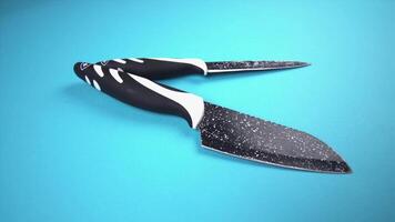 different shape and size knives on light blue background video