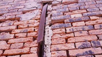 old building wall of red bricks with metal plank and window video