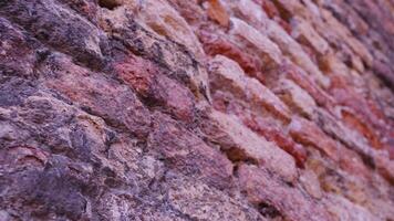 ancient building with facade made of red weathered bricks video