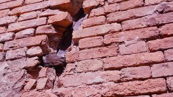 facade of abandoned building made of red bricks with hole video