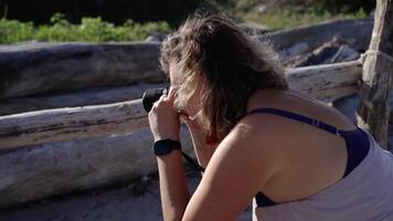 Professional photographer with camera makes photos of model video